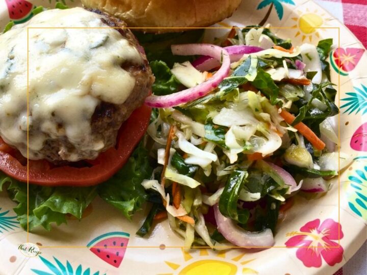 Cole slaw and burger on a plate