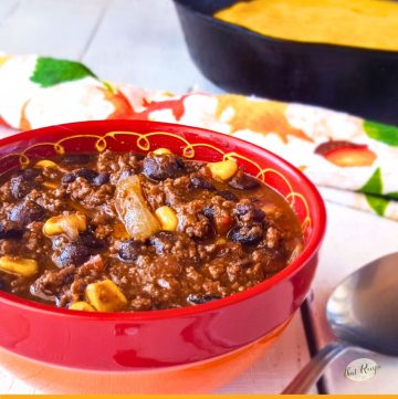 bowl of black bean chili with cornbread