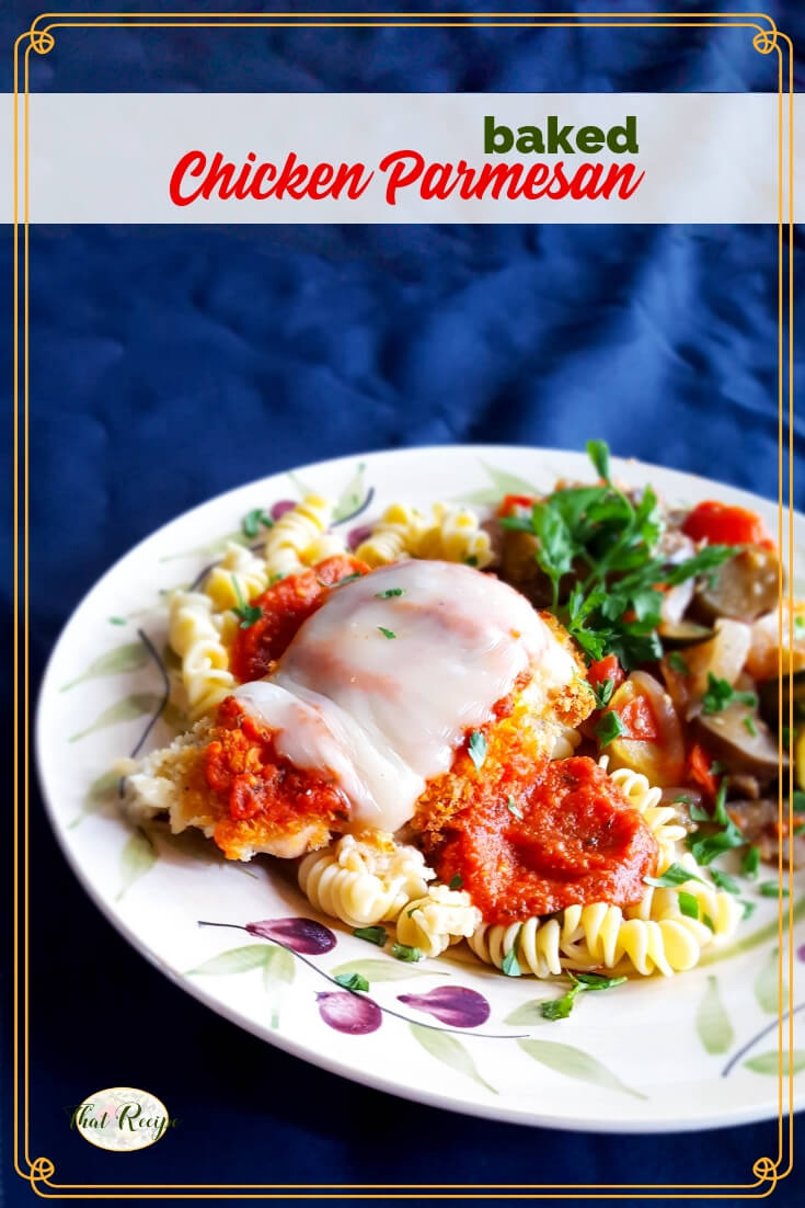 baked chicken parmesan on a plate with pasta and vegetables