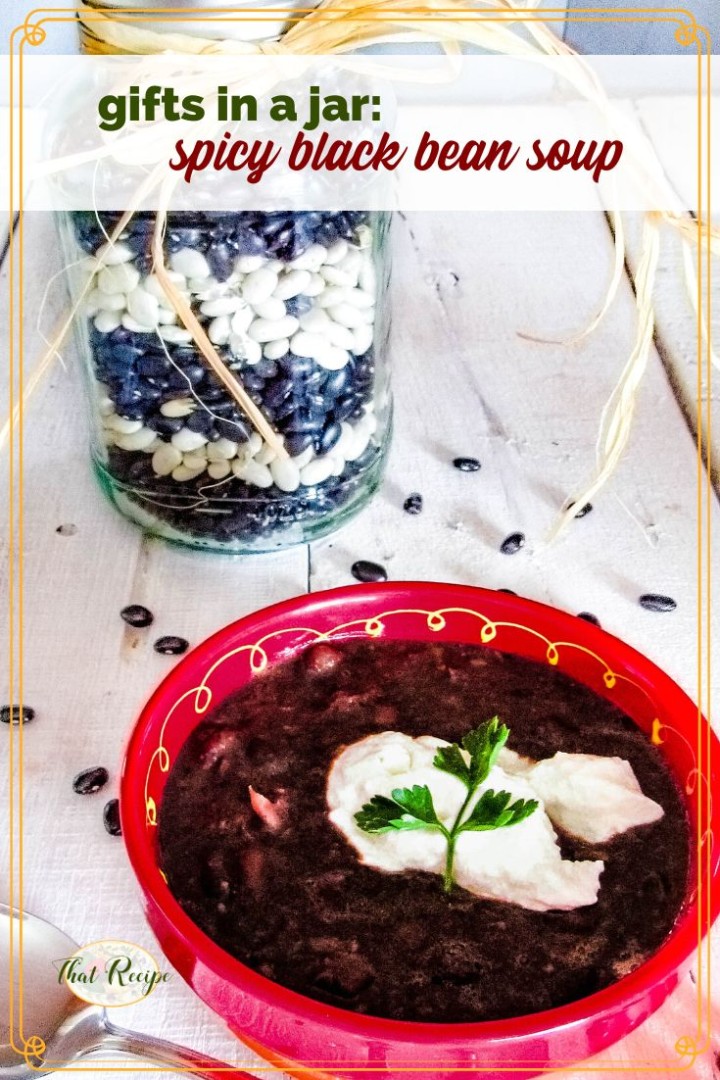 bowl of black bean soup with text overlay "gifts in a jar spicy black bean soup"