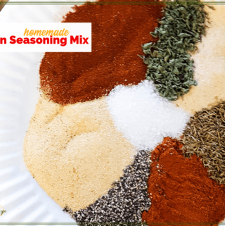 spices on a plate with text overlay "Homemade Cajun Seasoning Mix"