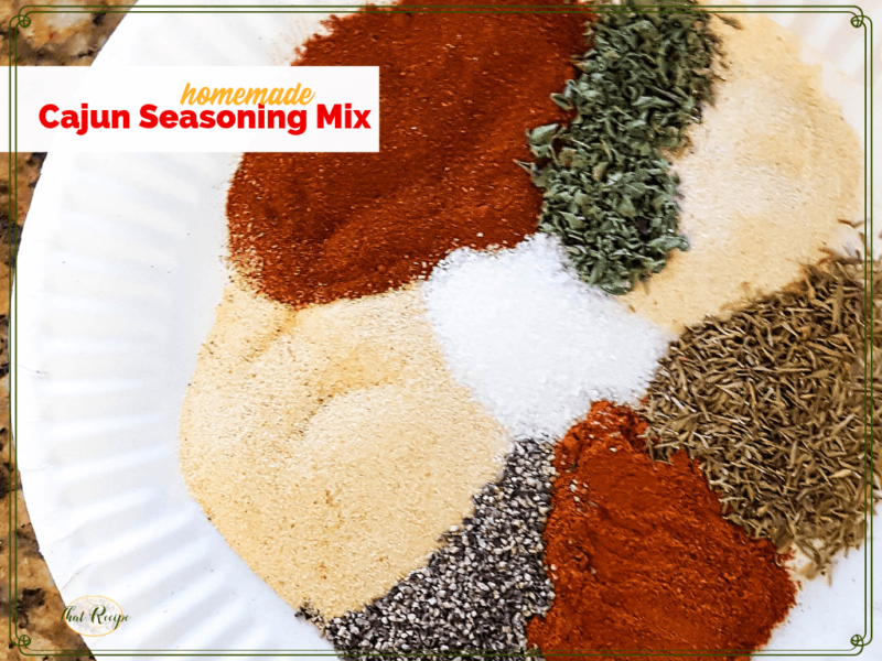 spices on a plate with text overlay "Homemade Cajun Seasoning Mix"