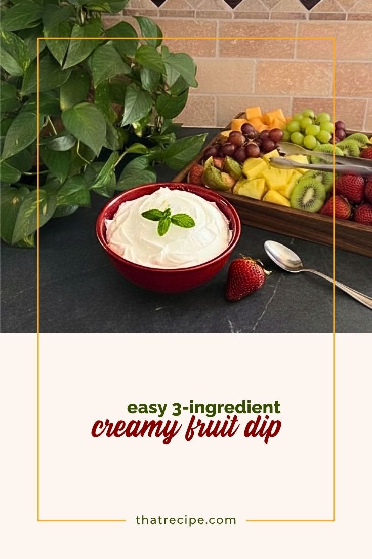 bowl of sweet creamy fruit dip with a tray of fruit