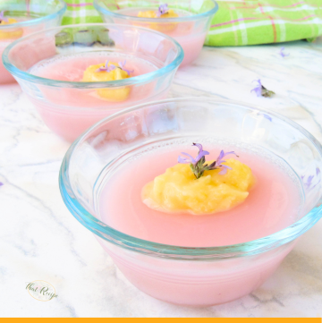 pink gelatin topped with lemon curd and purple flower