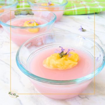 pink gelatin topped with lemon curd and purple flower
