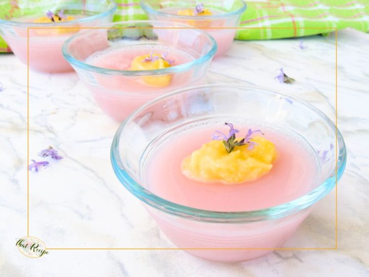 pink gelatin topped with lemon curd and purple flower