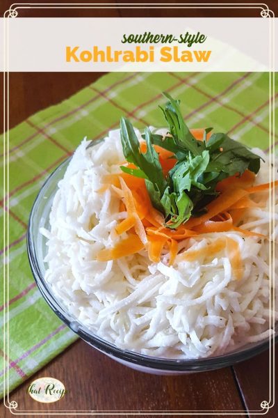 Kohlrabi Slaw with carrot and kale garnish in a bowl