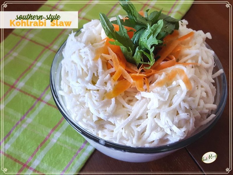 Kohlrabi Slaw with carrot and kale garnish in a bowl