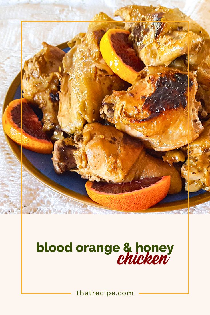 plate of cooked chicken pieces with blood orange slices 