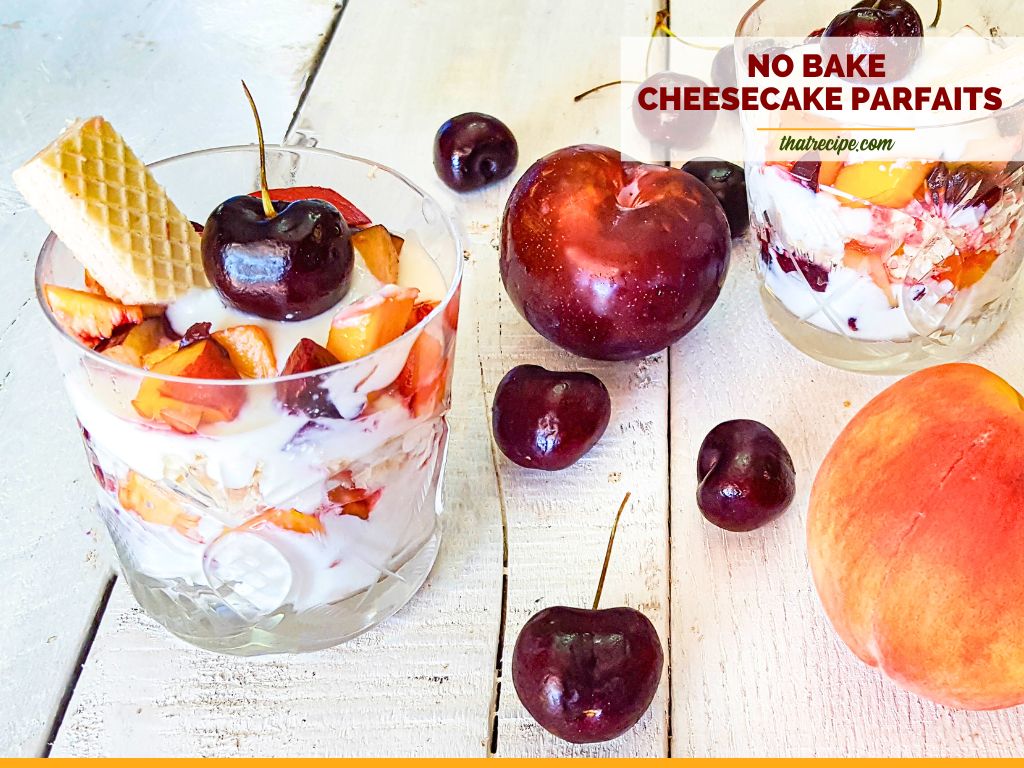 cheesecake parfaits on a table with summer fruits