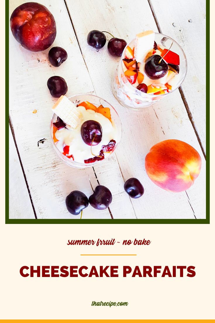 cheesecake parfaits on a table with summer fruits