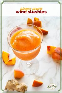 wine slushie on a marble backdrop with frozen peaches and giner and text overlay "ginger peach wine slushies"
