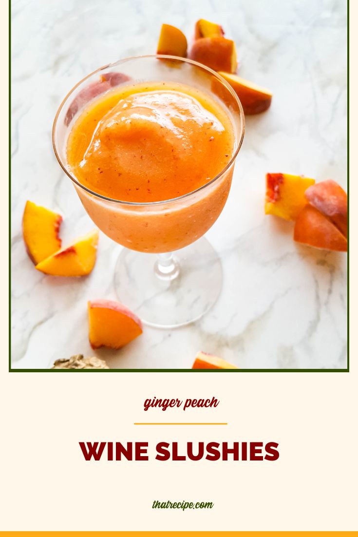 wine slushie on a marble backdrop with frozen peaches and ginger and text overlay "ginger peach wine slushies"