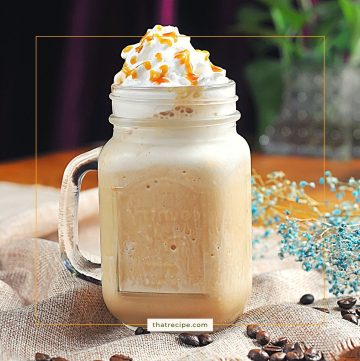 blended iced coffee drink in a mug with text overlay "vanilla caramel blended iced coffee"