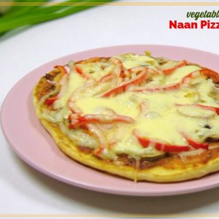 pizza on a plate with text overlay "vegetable naan pizza"