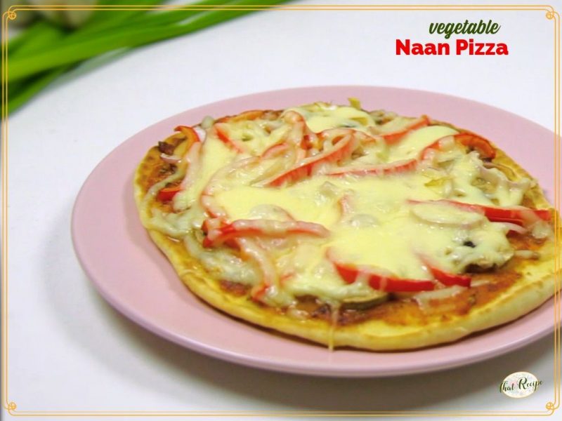 pizza on a plate with text overlay "vegetable naan pizza"