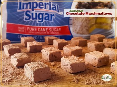 chocolate marshmallows on a cutting board with imperial sugar in the background