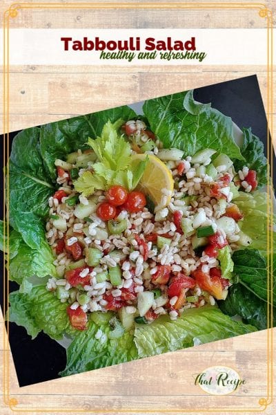 top down view of barley tabbouli salad on a bed of lettuce