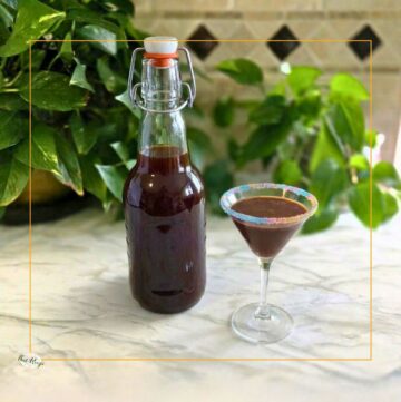 bottle of creme de cacao and a glass of chocolate martini