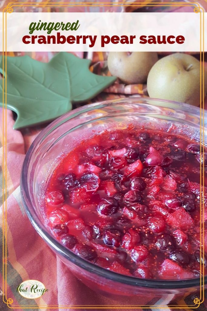 bowl of gingered cranberry pear sauce on a table with Asian pears