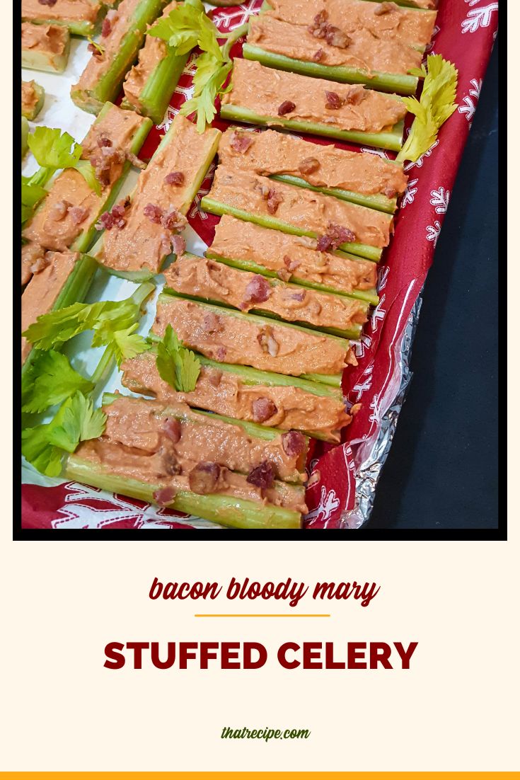 tray of stuffed celery with text overlay "Bacon Bloody Mary Stuffed Celery"