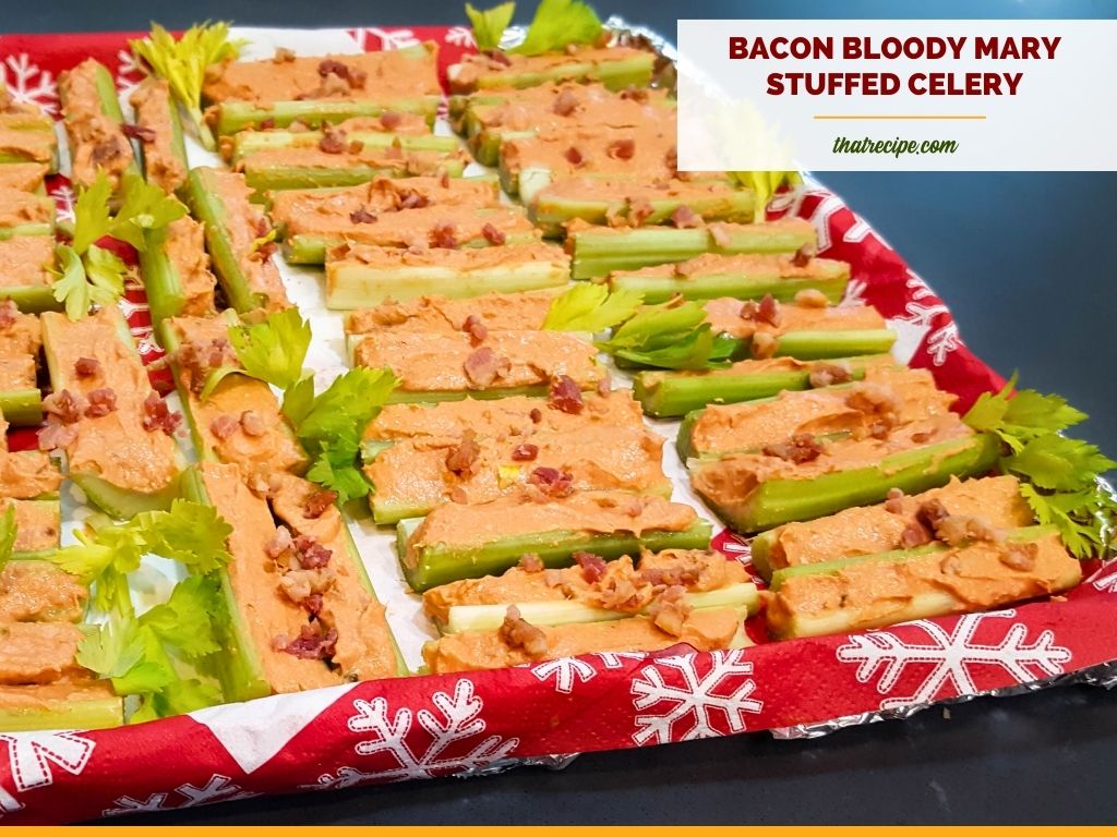 tray of stuffed celery with text overlay "Bacon Bloody Mary Stuffed Celery"