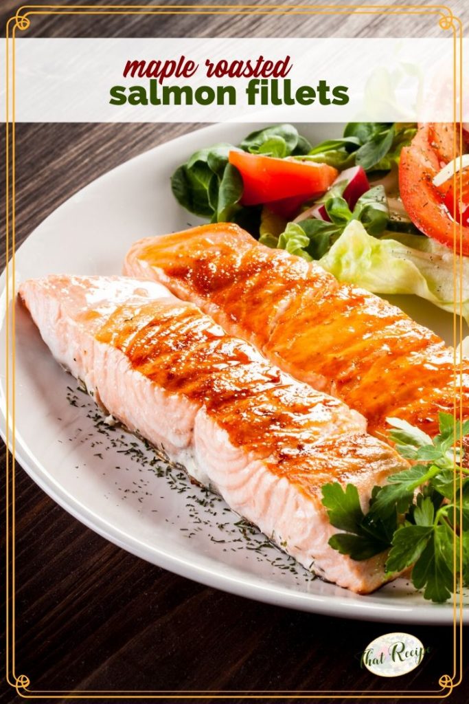 roasted salmon on a plate with a salad and text overlay "maple roasted salmon fillets"