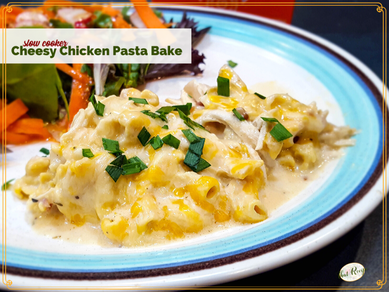 cheese pasta bake on a plate with a salad