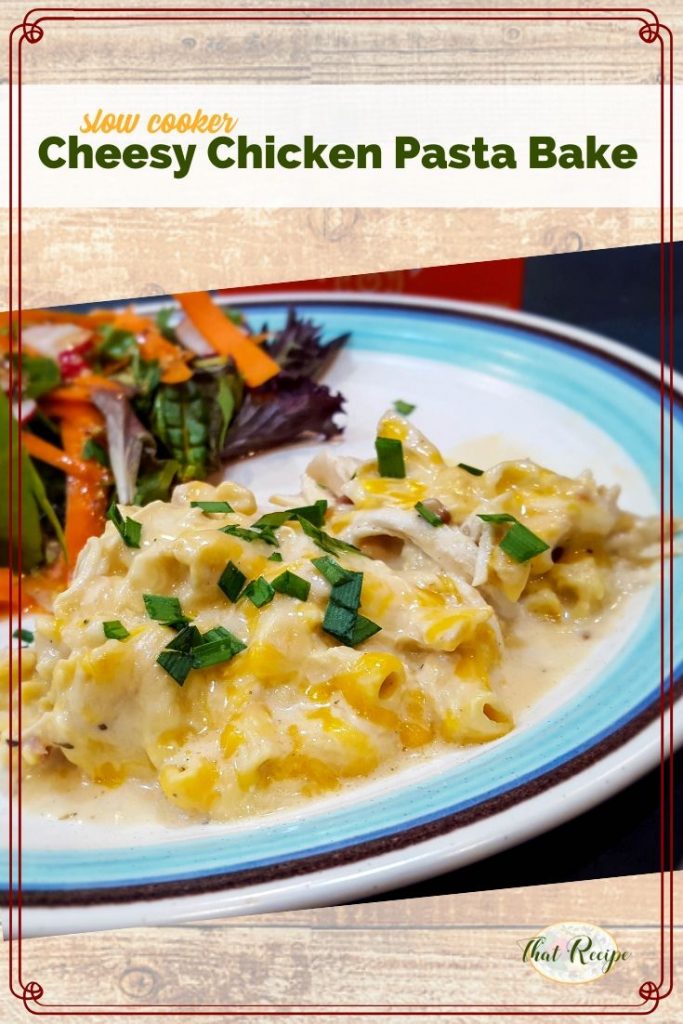 cheese pasta bake on a plate with a salad