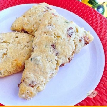 sun dried tomato and herb scones on a plate