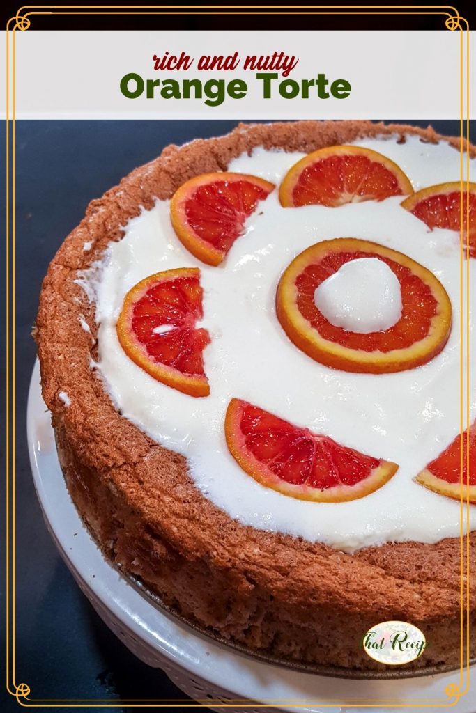 Nut torte with whipped cream and fresh orange slices with text overlay "Orange Pecan Torte"