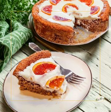 Nut torte with whipped cream and fresh orange slices