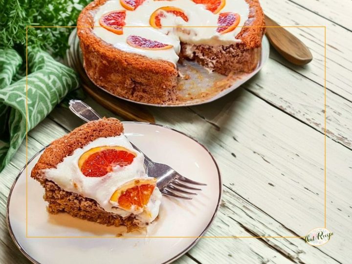 Nut torte with whipped cream and fresh orange slices