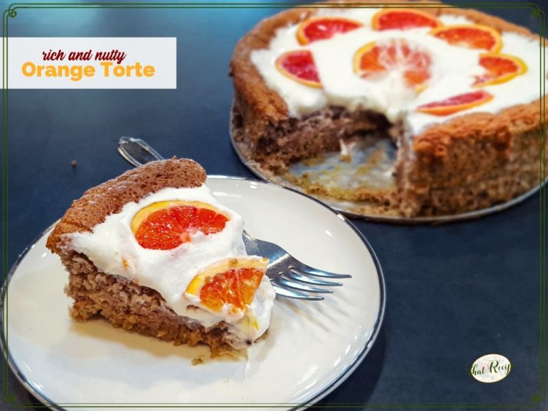 Nut torte with whipped cream and fresh orange slices with text overlay "Orange Pecan Torte"