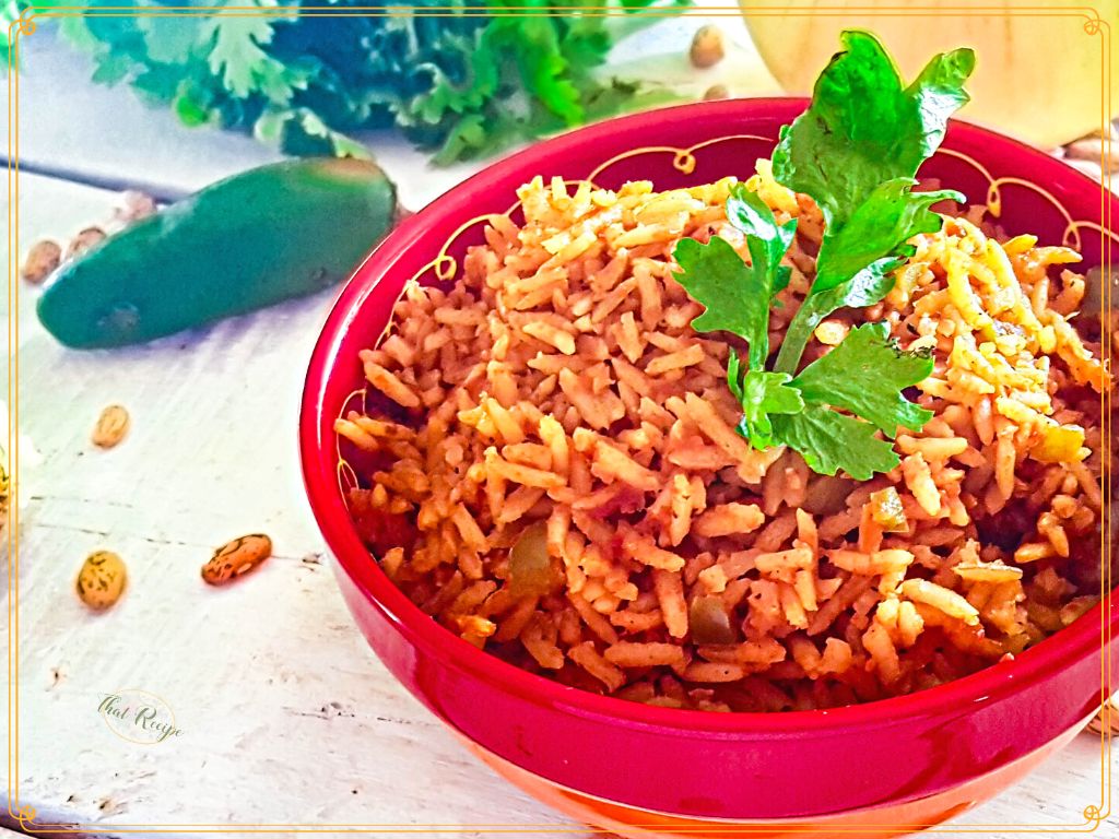 spanish rice in a bowl topped with cilantro
