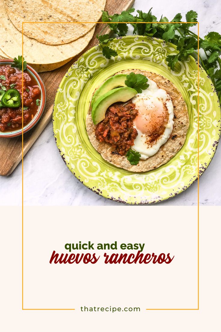 huevos rancheros on a plate with tortillas and a bowl of salsa