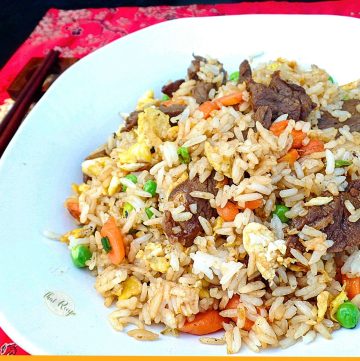 close up of a plate of beef fried rice