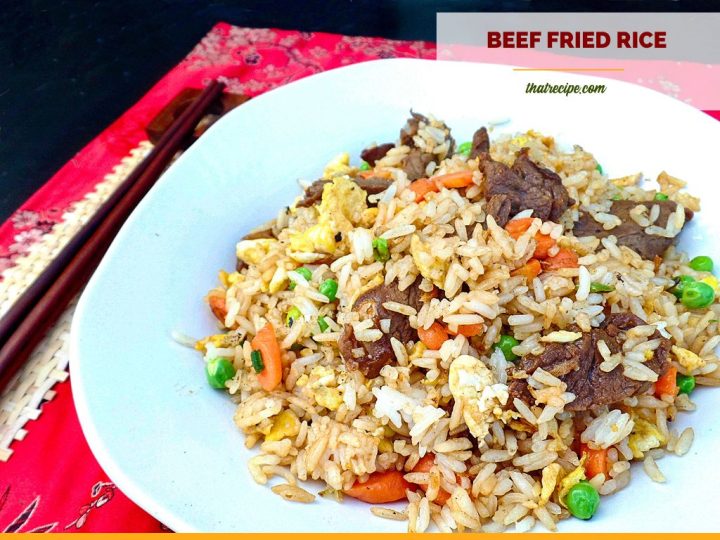 close up of a plate of beef fried rice