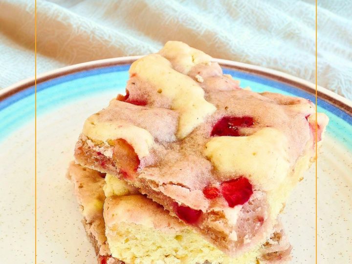 strawberry cream cheese swirl cookie bars on a plate