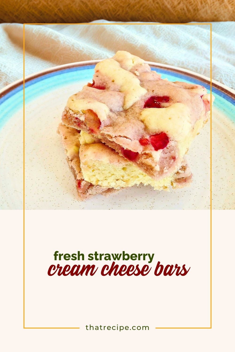 strawberry cream cheese swirl cookie bars on a plate