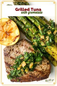 grilled tuna topped with gremolata and grilled lemons and asparagus
