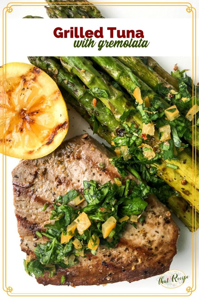 grilled tuna topped with gremolata and grilled lemons and asparagus