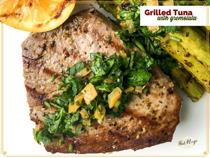 grilled tuna topped with gremolata and grilled lemons and asparagus