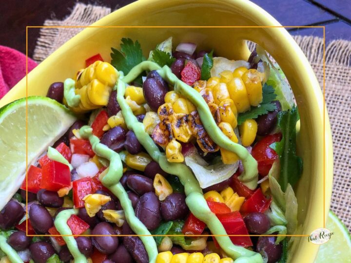 southwestern salad with lettuce, grilled corn, black beans, bell pepper and an avocado dressing