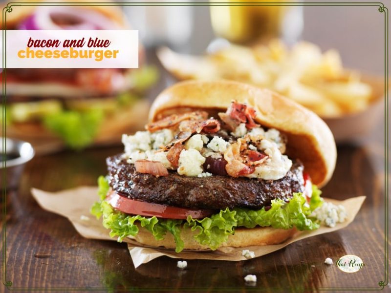 bacon and blue cheese burger on a table with fries