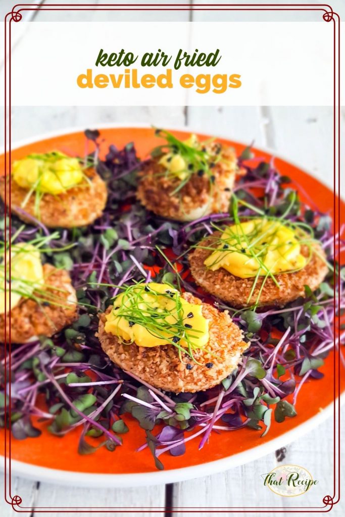 fried deviled eggs on bed of microgreens with text overlay "keto air fried deviled eggs"