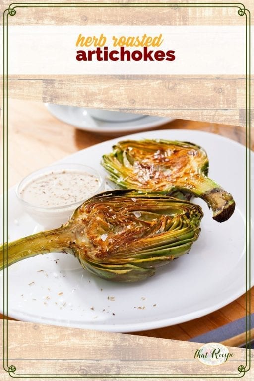 artichoke halves on a plate with dipping sauce ad text overlay "herb roasted artichokes"