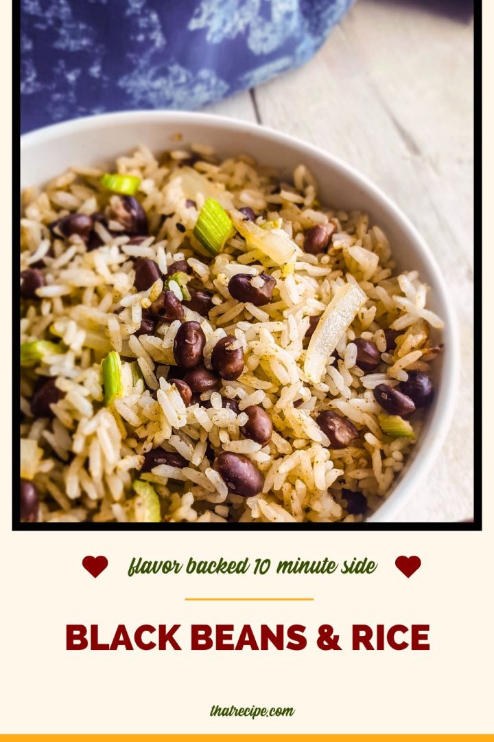 bowl of black beans and rice on white wood background with blue cloth
