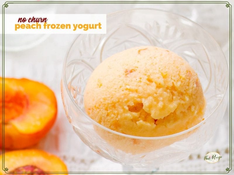 peach yogurt in a glass dish with cut fresh peach next to it and text overlay "no churn peach frozen yogurt"