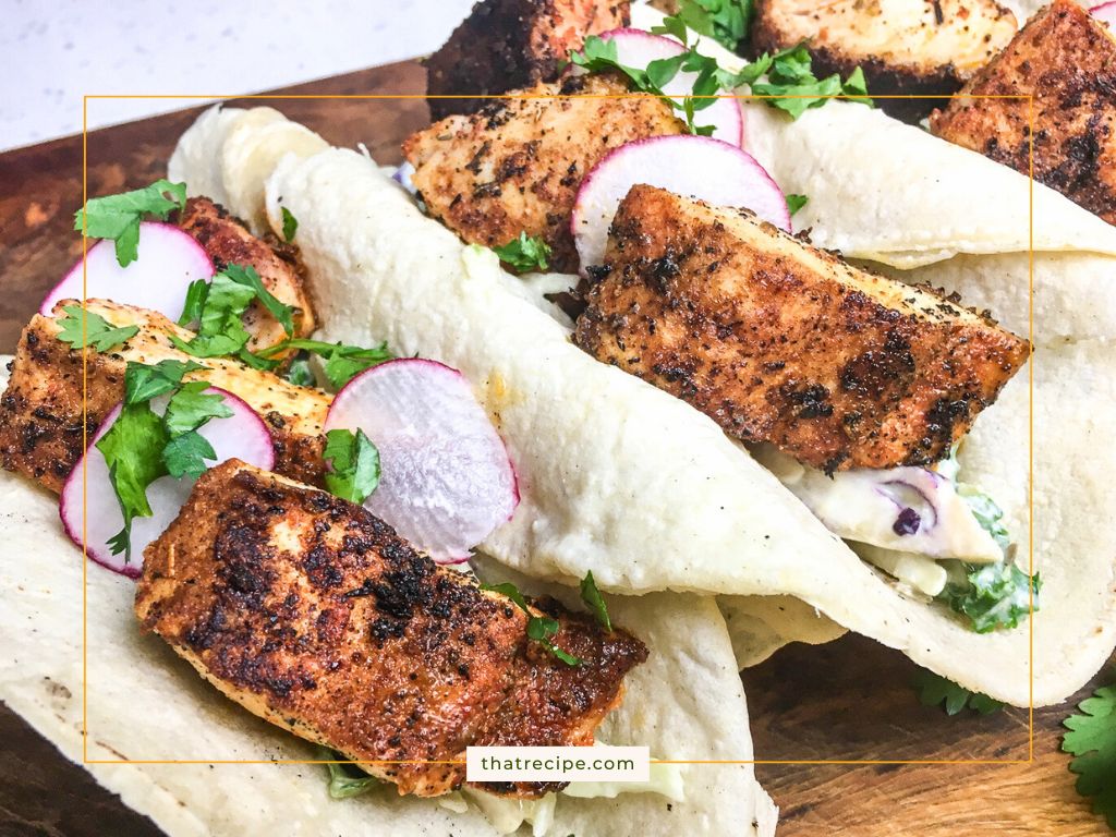 fish tacos with sauce and radish slices
